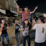 Palestinians in war-ravaged Gaza celebrate ceasefire news, joy in Tel Aviv