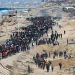 Displaced Gazans heading north to wrecked homes as Israeli troops withdraw after truce